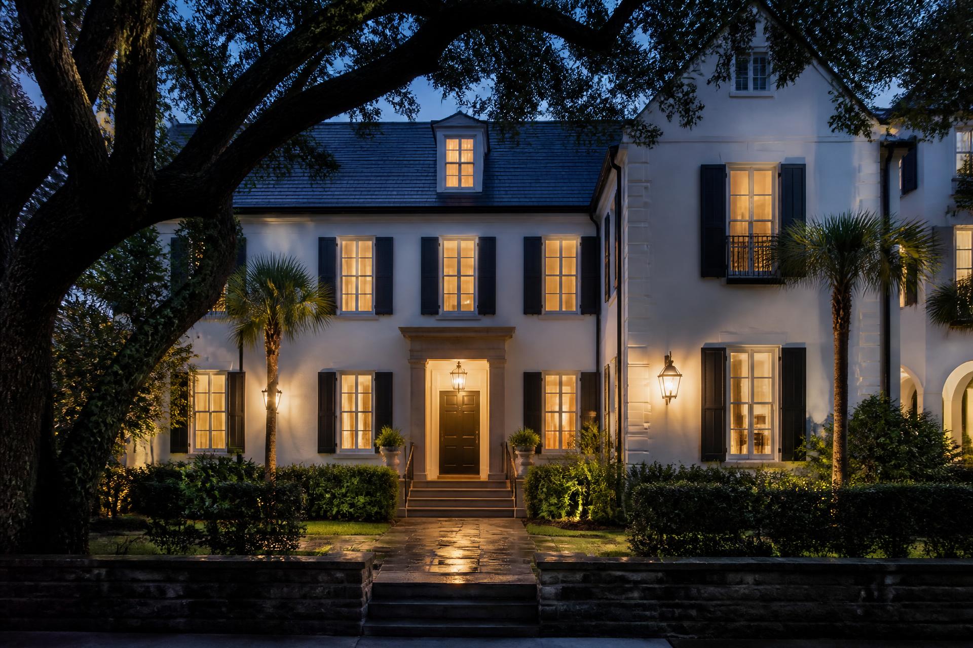 Charleston residence illuminated at dusk